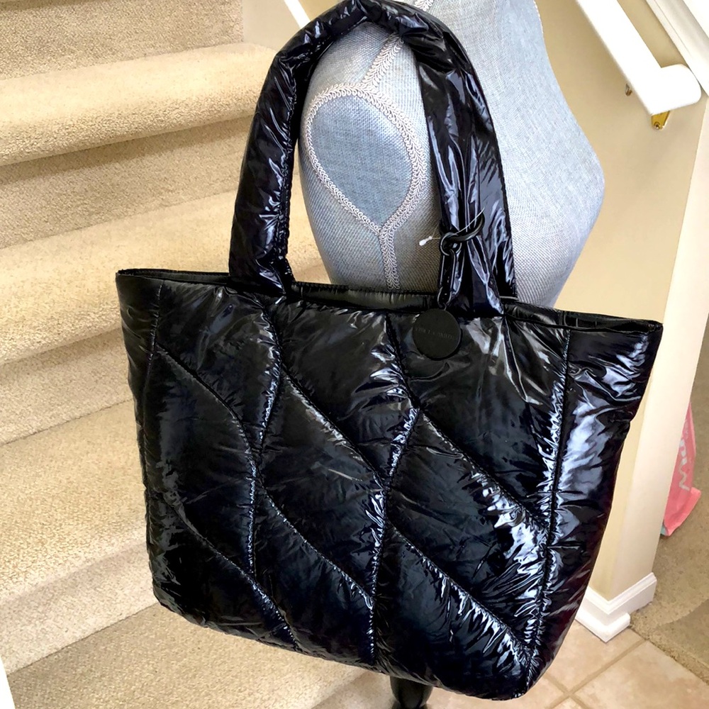 New Vince Camuto Leesa shinny black puffy tote purse. Outside large pocket.